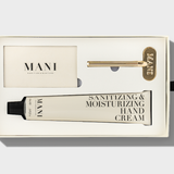 Mani sanitizing and moisturizing hand cream set with packaging on a light gray background