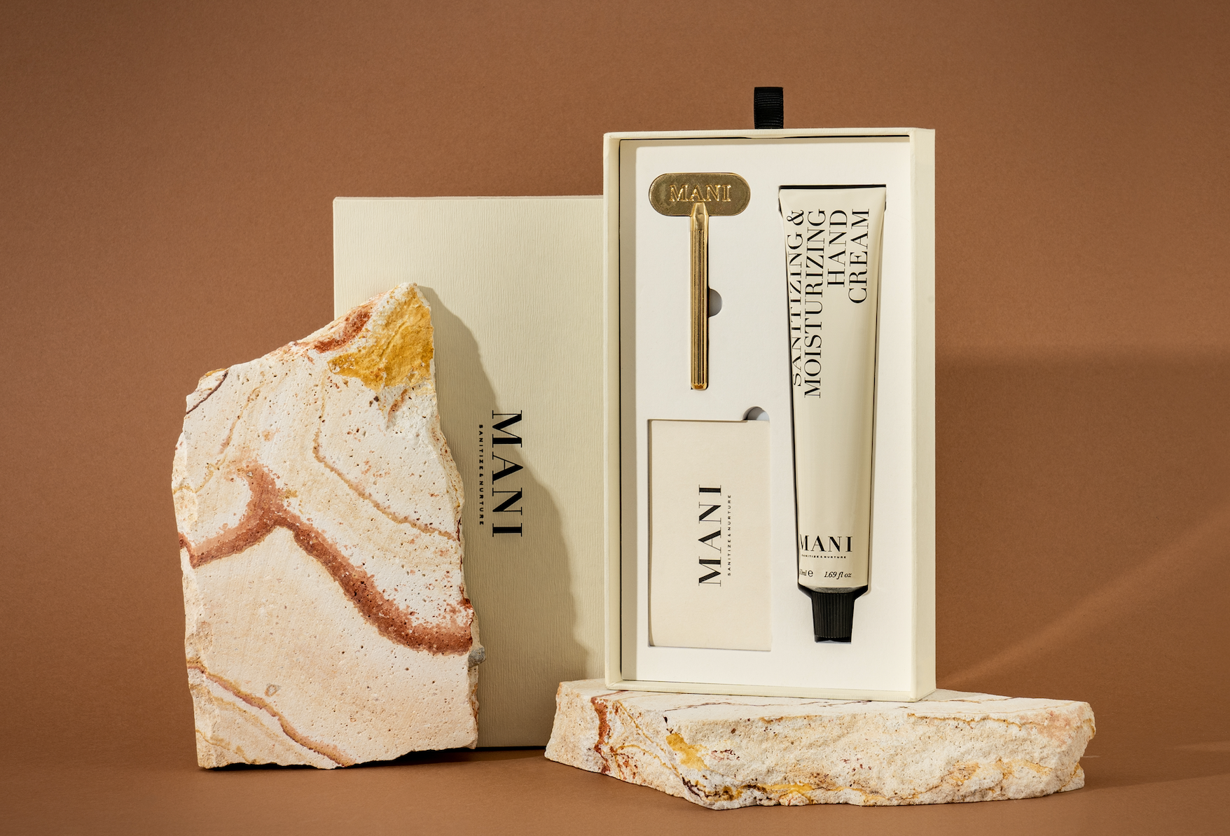 Skincare product set with a marble-textured base on a brown background