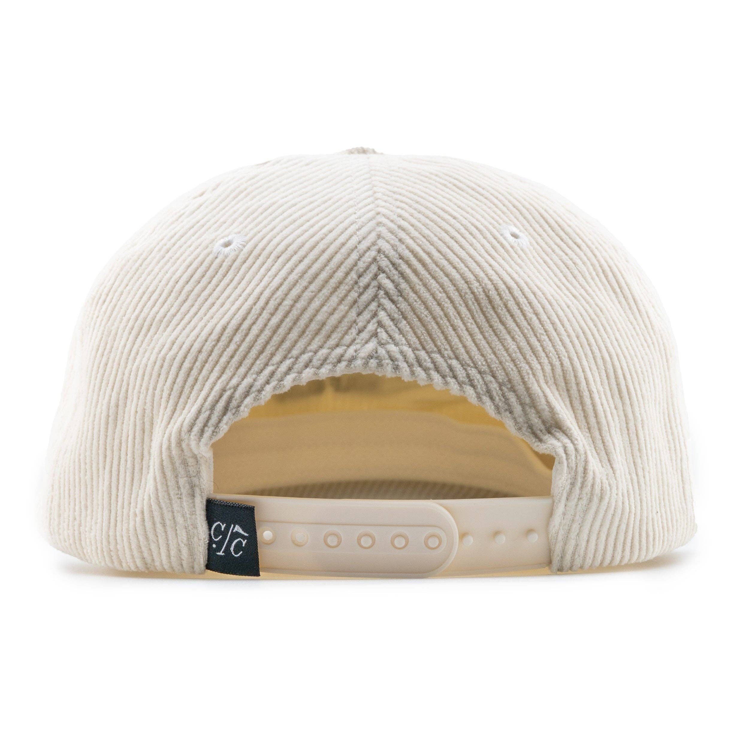Beige corduroy cap with a brand logo on the back on a white background