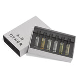 Set of six small perfume bottles in a box with 'A. N. Other' branding on a white background.