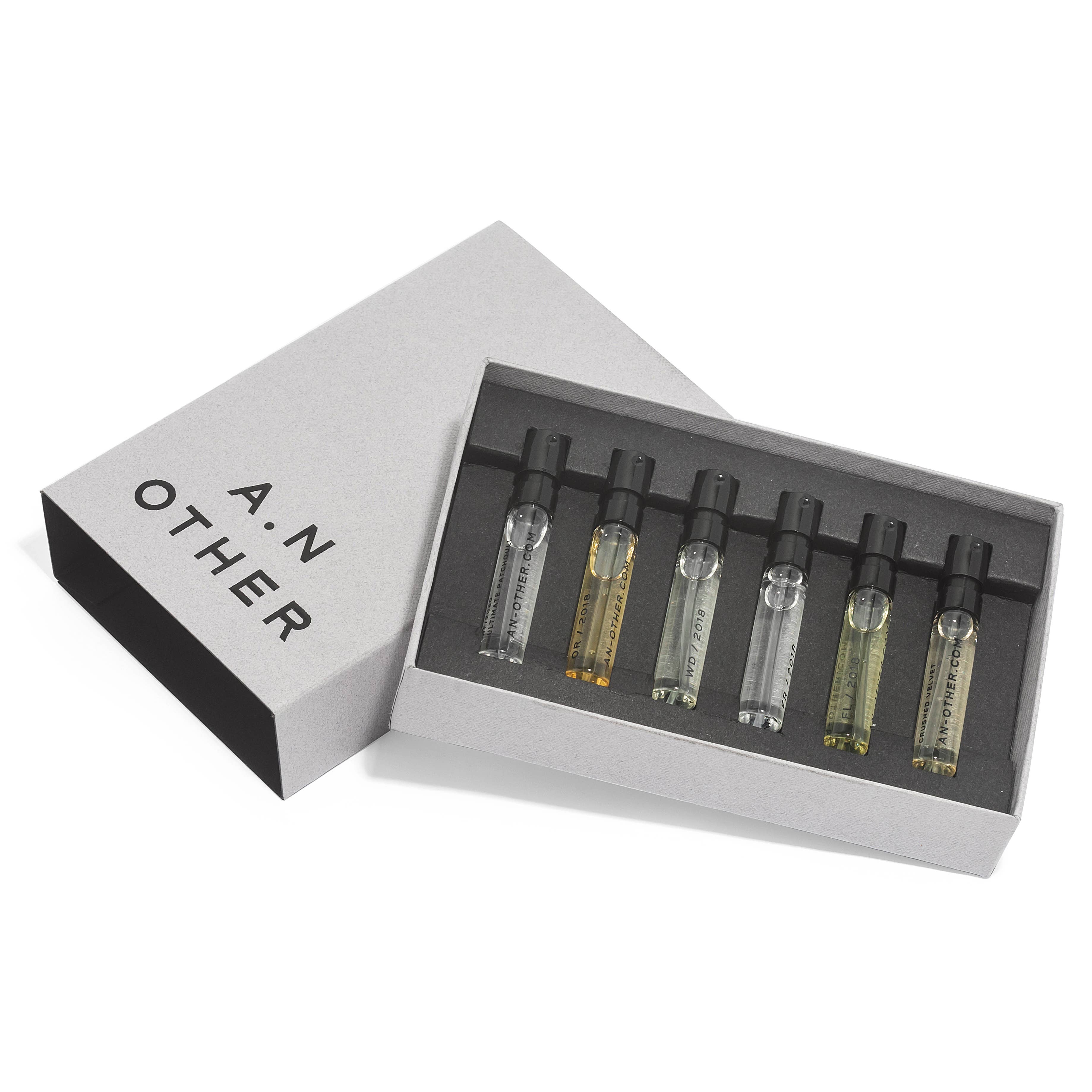 Set of six small perfume bottles in a box with 'A. N. Other' branding on a white background.